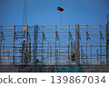 High-rise construction site and workers 139867034