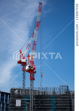 Tower crane at a high-rise construction site Tower crane at a high-rise construction site 139867036