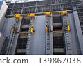 Construction elevators at high-rise building sites 139867038