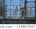 High-rise construction site and workers 139867043