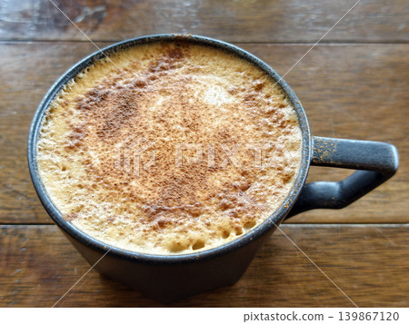 hot Mocaccino or cappuccino coffee in mug cup in cafe hot Mocaccino or cappuccino coffee in mug cup in cafe 139867120