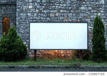Wide format billboard in front of a stone wall. Wide format billboard in front of a stone wall. 139867189