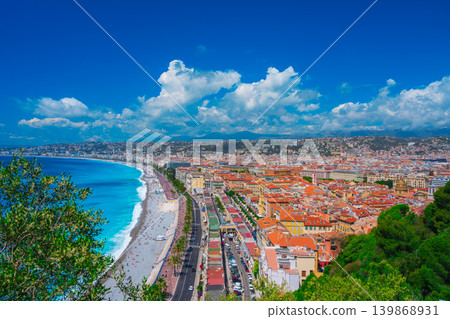 A woman overlooking the sea and city of Nice 139868931