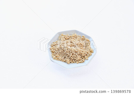 Ground sesame seeds served in a small bowl 139869578