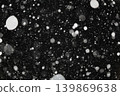 Light and light snowflakes on a dark background.  139869638