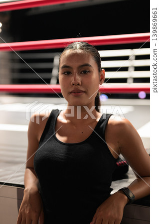 Vertical Portrait of Female Athlete in Boxing Ring Vertical Portrait of Female Athlete in Boxing Ring 139869661