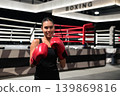 Horizontal Shot of Smiling Female Boxer in Ring 139869816