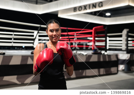 Horizontal Shot of Smiling Female Boxer in Ring Horizontal Shot of Smiling Female Boxer in Ring 139869816
