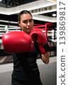 Close Up of Female Boxer Punching Towards Camera 139869817