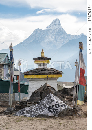 Mt.Ama Dablam seen from Khumjung village, Nepal. Khumjung and Khunde are neighboring Sherpa villages in Nepal's Everest region. Mt.Ama Dablam seen from Khumjung village, Nepal. Khumjung and Khunde are neighboring Sherpa villages in Nepal's Everest region. 139870324