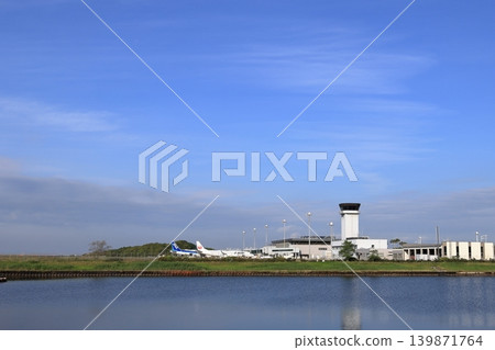 A sunny May day at the airport and two airplanes. 139871764