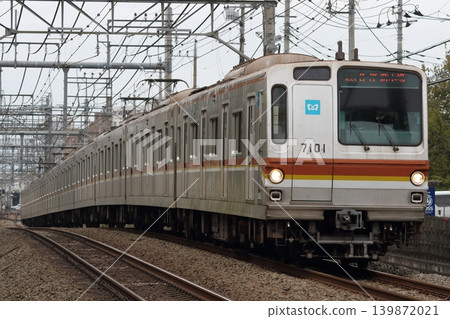 Tokyo Metro 7000 series train 7101F running between Nishi-Tokorozawa and Tokorozawa. Tokyo Metro 7000 series train 7101F running between Nishi-Tokorozawa and Tokorozawa. 139872021