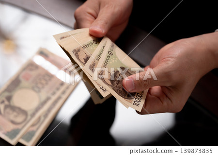 A man counting money A man counting money 139873835