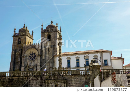 Historic Porto Cathedral with decorative stone pillar under blue sky in Portugal 139873877