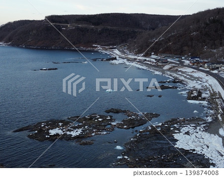 Aerial view of the winter scenery along Route 334 coastal road in Utoro, Shari Town. 139874008