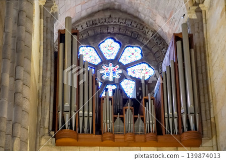 Pipe organ and stained glass rose window inside historic Porto Cathedral Portugal 139874013