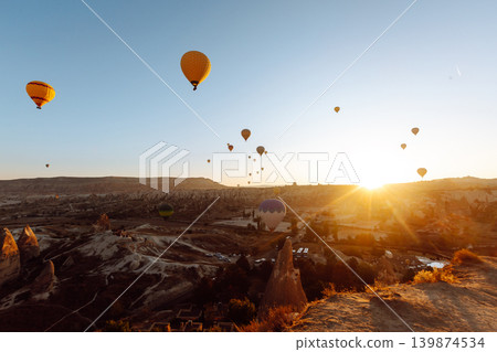Hot Air balloons flying tour over Mountains landscape spring sunrice Cappadocia Goreme National Park 139874534