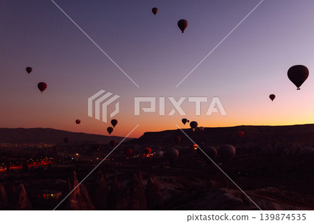 Hot Air balloons flying tour over Mountains landscape spring sunrice Cappadocia Goreme National Park 139874535