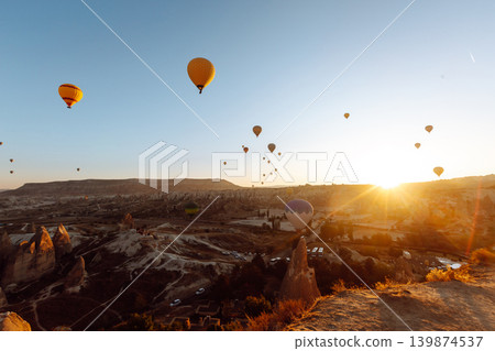 Hot Air balloons flying tour over Mountains landscape spring sunrice Cappadocia Goreme National Park 139874537