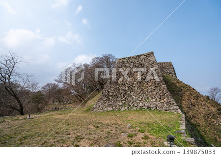 The castle tower base of Tsuwano Castle stands out against the blue sky. The castle tower base of Tsuwano Castle stands out against the blue sky. 139875033