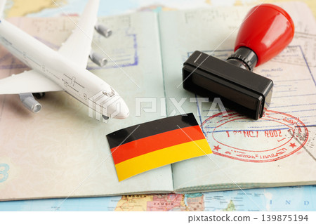 Germany flag and passport with airplane for travel. Germany flag and passport with airplane for travel. 139875194