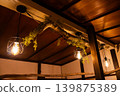 The warm lighting of a retro cat cafe 139875389