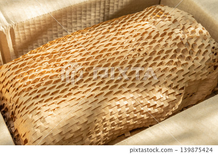 Eco friendly brown paper honeycomb wrap for product packaging parcel carton box 139875424