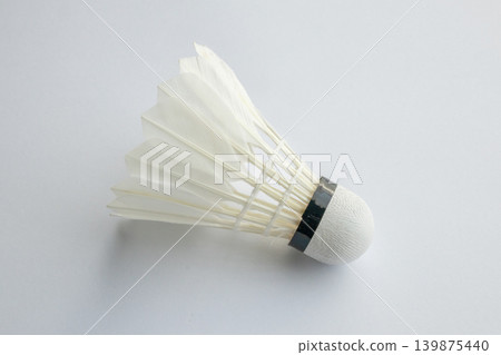 feather badminton shuttlecock on white paper texture background 139875440