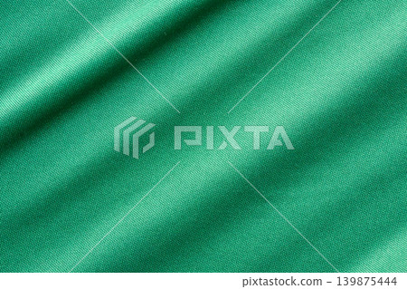 Green sports clothing fabric football shirt jersey texture close up Green sports clothing fabric football shirt jersey texture close up 139875444