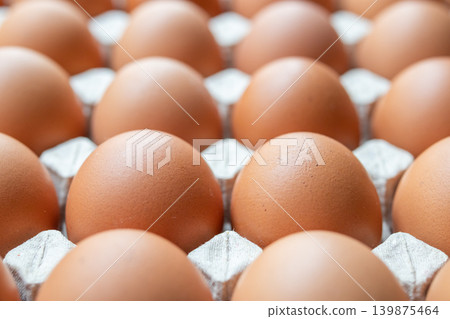 Fresh organic brown chicken eggs in cardboard tray Fresh organic brown chicken eggs in cardboard tray 139875464