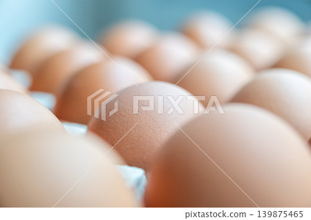 Fresh organic brown chicken eggs in cardboard tray Fresh organic brown chicken eggs in cardboard tray 139875465