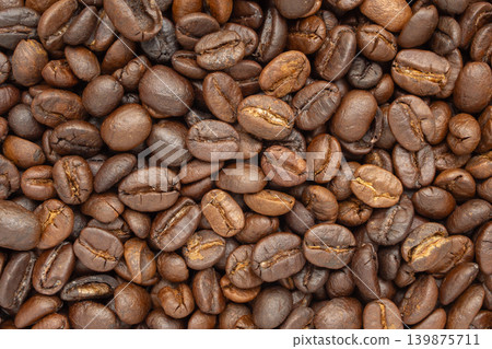 Fresh premium roasted brown Arabica coffee beans background Fresh premium roasted brown Arabica coffee beans background 139875711