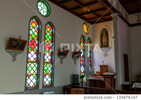 Colorful stained glass windows in a historic Catholic chapel in Tsuwano Colorful stained glass windows in a historic Catholic chapel in Tsuwano 139876187