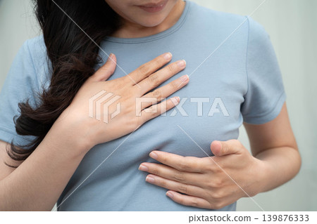 Asian woman self touching check lump or Breast cancer, Breast Self Exam. Asian woman self touching check lump or Breast cancer, Breast Self Exam. 139876333