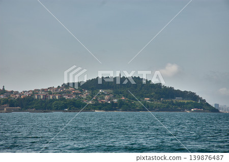 Panoramic view of the iconic Monte de la Guia from a boat sailing in the Vigo estuary Panoramic view of the iconic Monte de la Guia from a boat sailing in the Vigo estuary 139876487