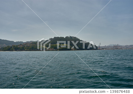 Panoramic view of the iconic Monte de la Guia from a boat sailing in the Vigo estuary 139876488
