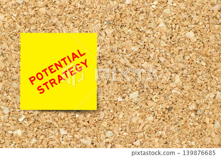 Yellow note paper with word potential strategy on cork board background with copy space Yellow note paper with word potential strategy on cork board background with copy space 139876685