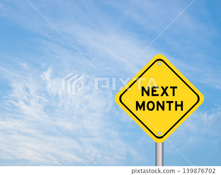 Yellow transportation sign with word next month on blue color sky background Yellow transportation sign with word next month on blue color sky background 139876702