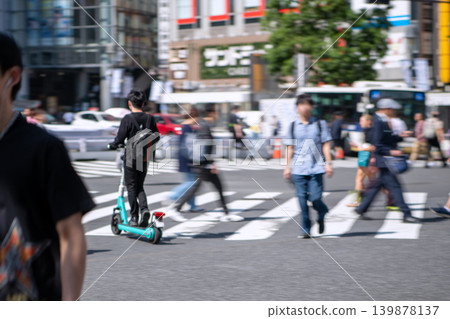 Japan's Tokyo urban landscape blue ticket system will be implemented from April 1st, but... Shibuya Scramble Crossing during rush hour... electric kick scooters 139878137