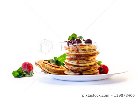 Sweet breakfast pancakes with fresh berries isolated on white Sweet breakfast pancakes with fresh berries isolated on white 139878406