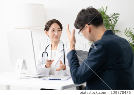 A man consults a doctor 139878476