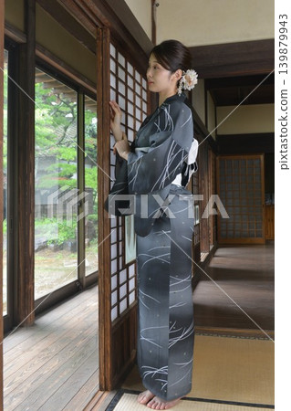 A young woman in a yukata A young woman in a yukata 139879943