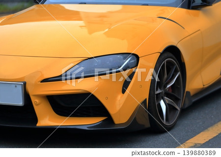 Yellow Japanese sports car 139880389