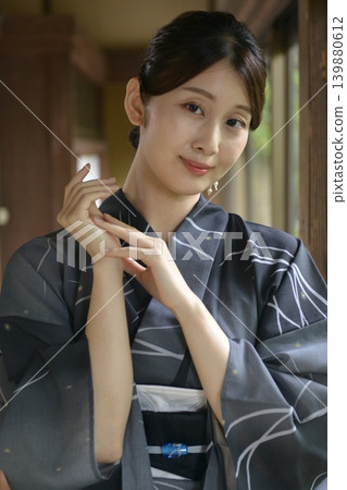 A young woman in a yukata A young woman in a yukata 139880612