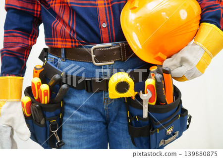 Male builder worker with tool belt pocket at waist. Male builder worker with tool belt pocket at waist. 139880875