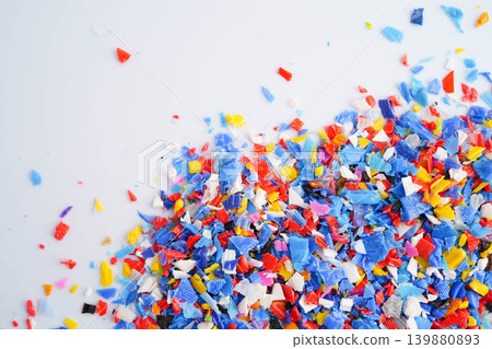 Plastic colorful pieces recycling shredded for industrial use. Plastic colorful pieces recycling shredded for industrial use. 139880893