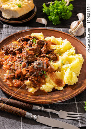 slow cooked beef meat stew served with mashed potatoes slow cooked beef meat stew served with mashed potatoes 139881264