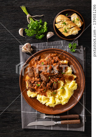 slow cooked beef meat stew served with mashed potatoes slow cooked beef meat stew served with mashed potatoes 139881266