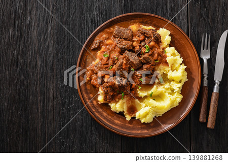 slow cooked beef meat stew served with mashed potatoes slow cooked beef meat stew served with mashed potatoes 139881268