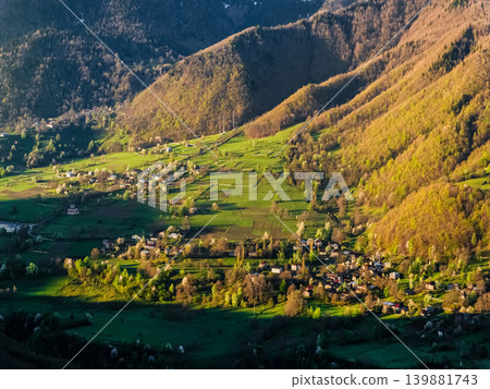 Golden light spills over rolling green hills Golden light spills over rolling green hills 139881743